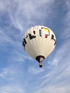 white hot air balloon at blue sky