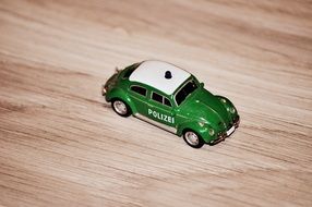 green police car model toy