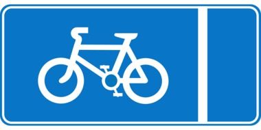 white bike on a blue road sign