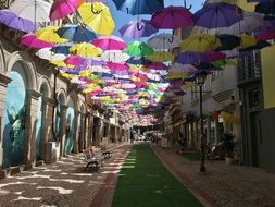 soaring umbrellas on the street of the city of Agueda