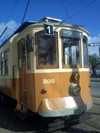 historic tram on the streets of sunny portugal