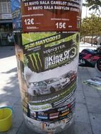 glued posters on the pole