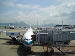 airplane landing passengers at hong kong airport