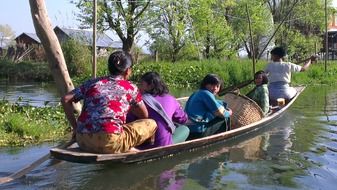 locals in a boat in myanmar