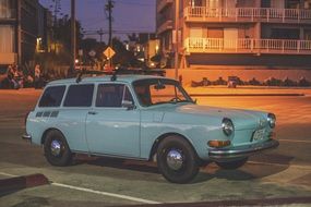 vintage blue car on the road