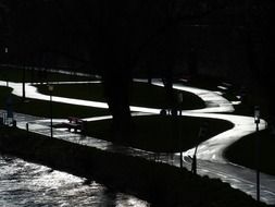 night photo of meandering bike path