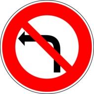 Black, red and white traffic sign in the form of a prohibitive turn to the left