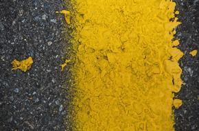 yellow marking strip on the road close up