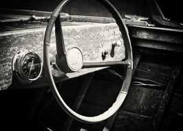 black and white photo of a car steering wheel