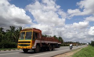 yellow truck on the highway in india