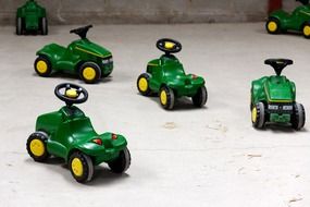 green and yellow toy tractors