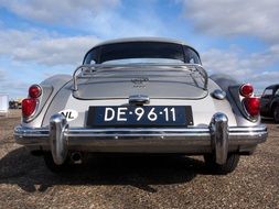 gray vintage car, back view