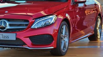 red mercedes in car dealership