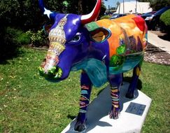 street sculpture in the form of a colored cow