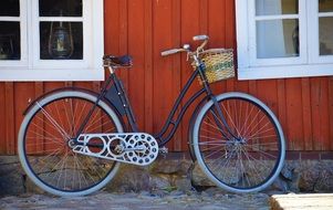 vintage ladies bike with basket at house