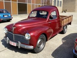 burgundy pickup Peugeot