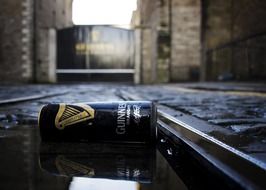 guinness can near tramline in dublin
