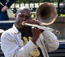 dark skin jazz musician on street