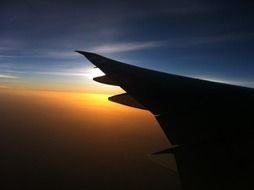 airplane wing at sunset