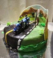 themed cake with a motorcycle