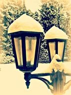 two street lights under the snow