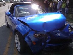 blue Mazda after the accident