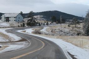 panoramic view of a curved road in winter