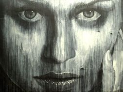 female face graffiti on the wall