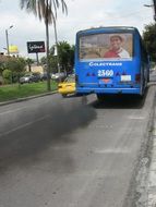 exhaust fumes from the bus on a city street in ecuador