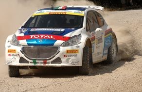 Colorful racing car on the sand in Sardinia