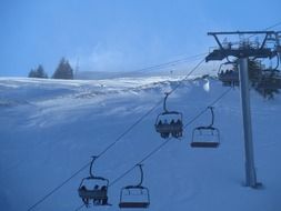 ski lift on a snowy hill