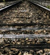 pebbles among the sleepers on the rails