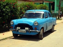 blue retro car parked on street, cuba