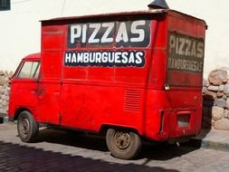 old red truck of pizza delivery service