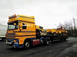 big yellow truck in the parking lot