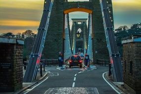 cars on bridge at dusk, uk, england, bristol