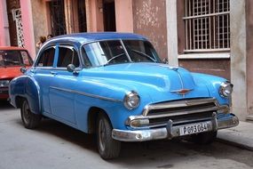 blue old car on the street in Havana