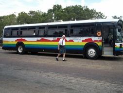 man near the tourist bus