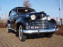 black old opel on a sunny street