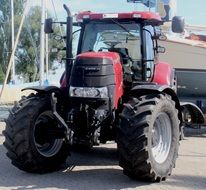 tractor with big wheels on the road
