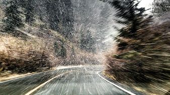 Heavy snow on the road in winter