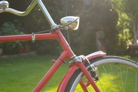 Red bicycle in the sun