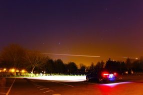 a car stands on the road at night