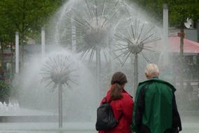 people looking at fountain in dresden