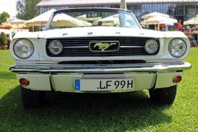 ford mustang, front view of oldtimer car on lawn