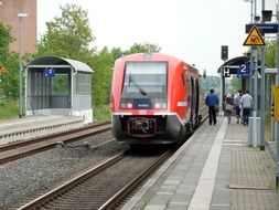 red trains on a railway station in Germany