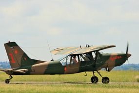 military plane on green grass