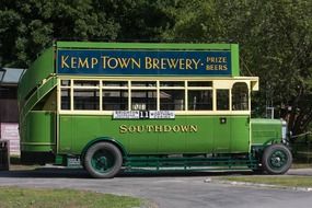 green retro bus with kemp town brewery banner, uk, england, West Sussex