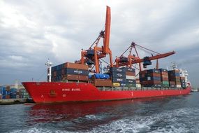 red cargo ship in port