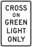 Cross on green light only roadsign